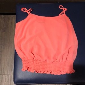 Orange body suit and tank